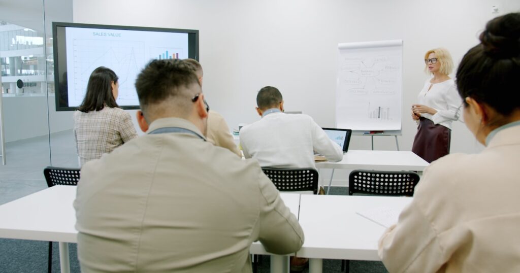 Participants at a professional training session in a modern seminar room