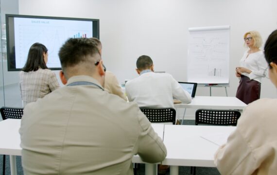 Participants at a professional training session in a modern seminar room
